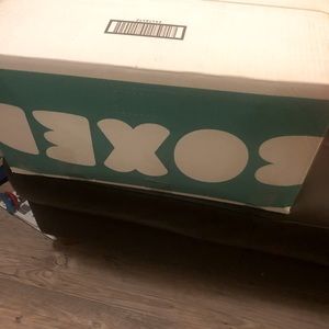 Two bags of baby boy cloths in a box some are new and some are slightly used
